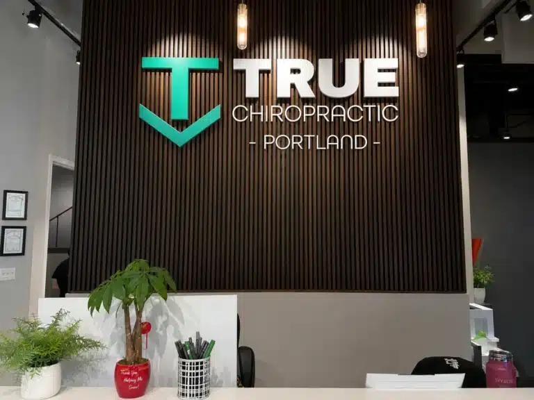 true-chiropractic-portland-logo-reception-wall